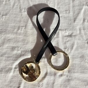 Longchamp Elegant Black Leather and Gold Hardware Keychain/Bag Charm